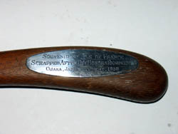 Engraved silver plaque on handle