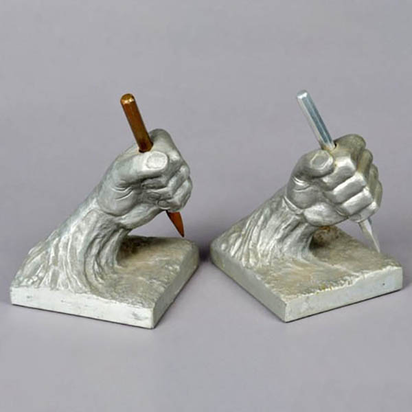 Pair of Hands Holding Chisels